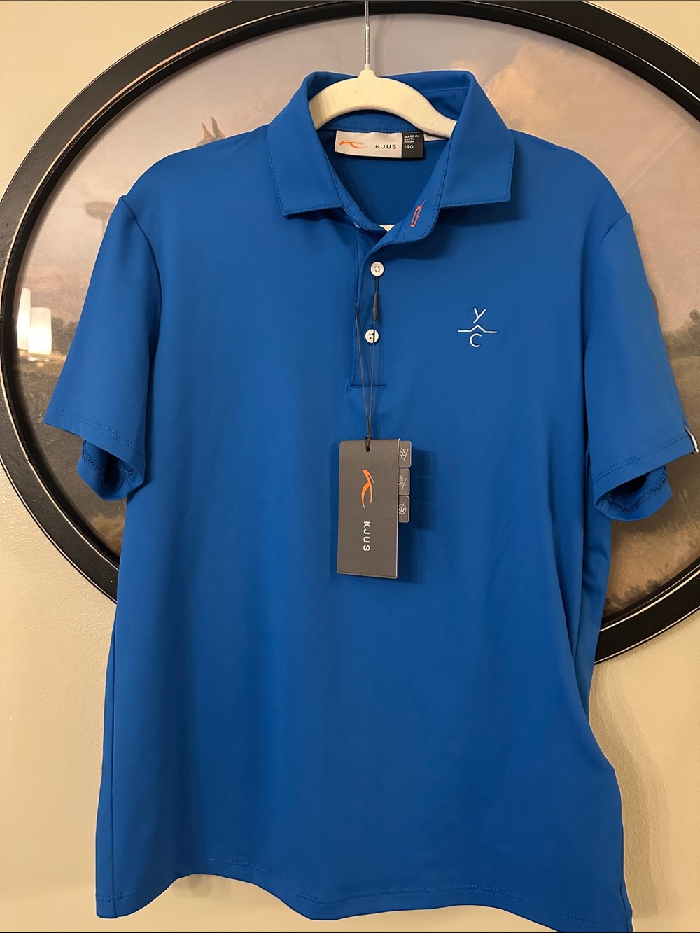 KJUS Boys' Royal Blue Polo Shirt - Lightweight Performance with YC logo